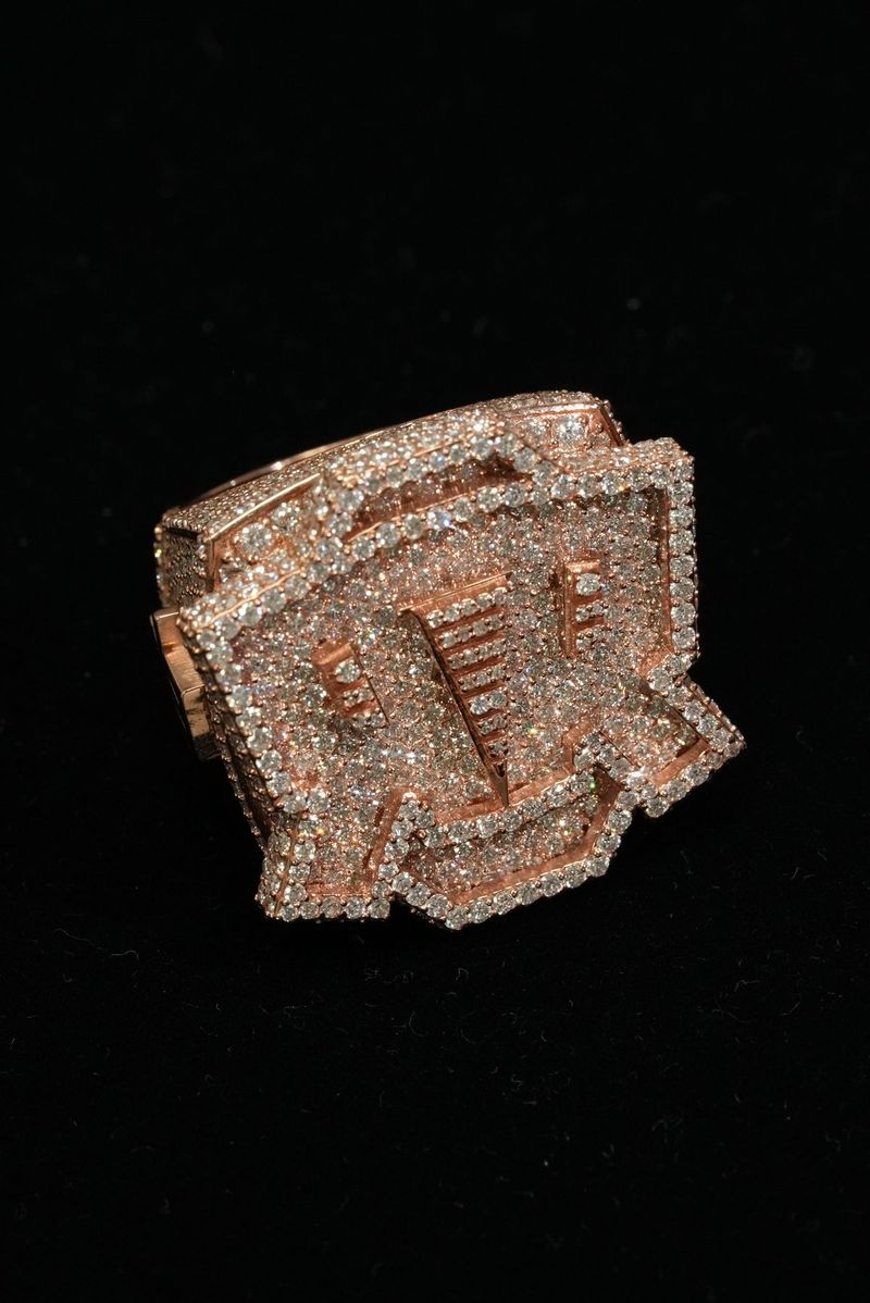 Rose gold diamond signet ring on black